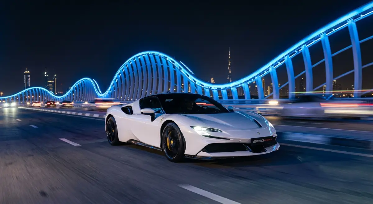 Luxury SUV driving through Dubai skyline